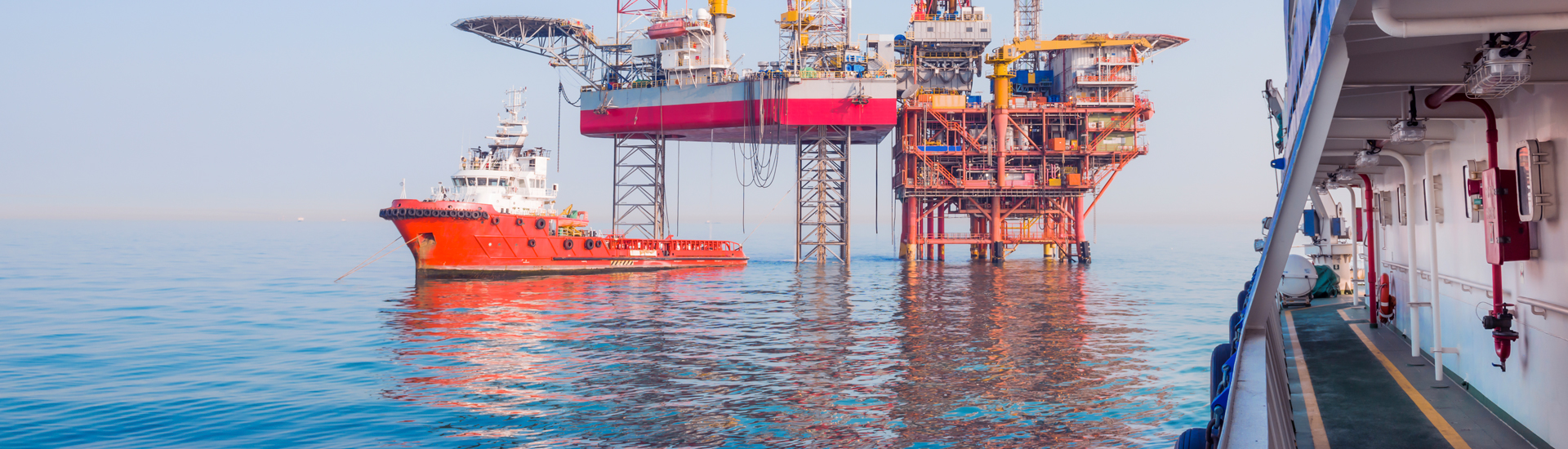 Oil rig and boat in the ocean