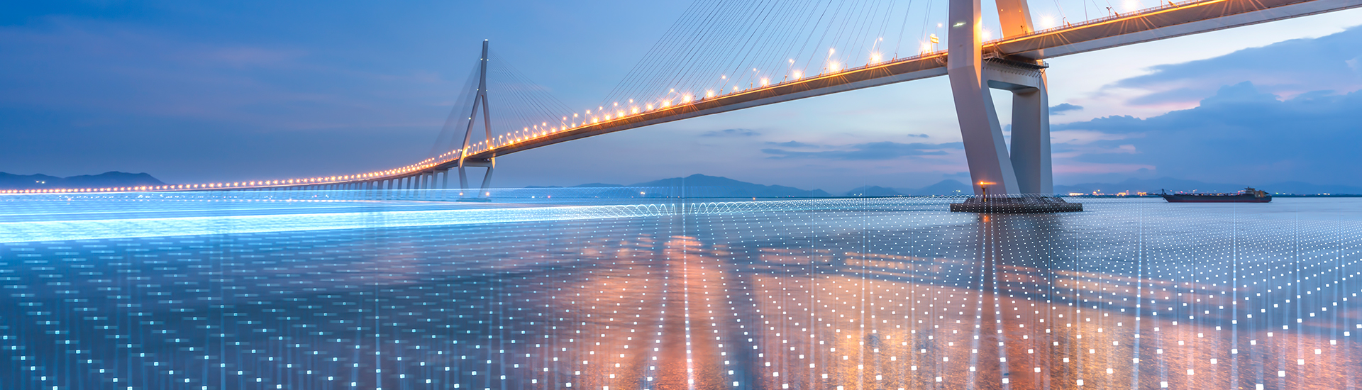 Bridge at dusk with data on water