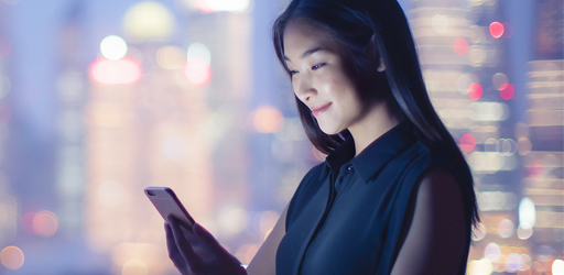 woman looking at cell phone 