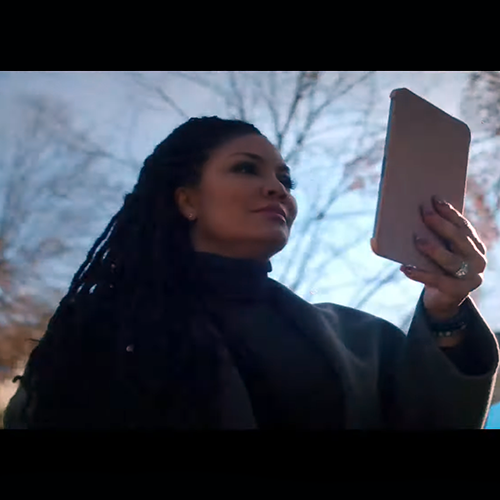 Egypt Sherrod looking at tablet